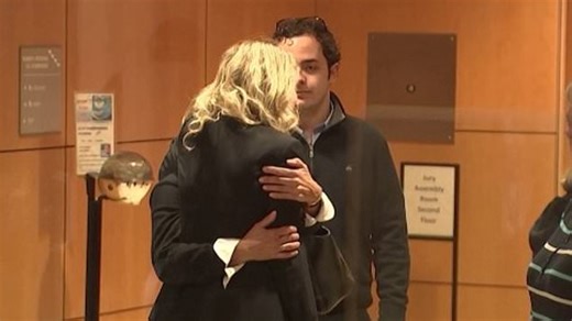 Pregnant Elizabeth Holmes receives hugs before sentencing in California court