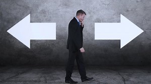 Confused Businessman Has Choose Between Two Stock Footage Video (100% Royalty-free) 1042072765 | Shutterstock