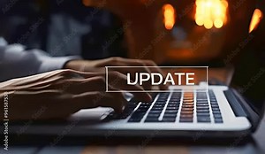 Person typing on laptop with progress bar and Update text, software update in progress, technology upgrade