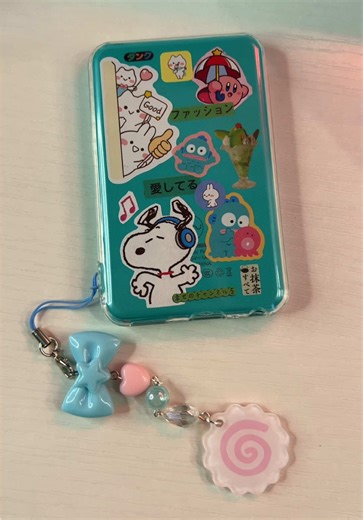 The new clear case for the Innioasis Y1 has a loop hole so you can add a wrist strap or a cutie charm! My amazing and talented friend @🍃Adrienne 🐌 made me this adorable charm for mine:) another fun and inexpensive way to customize your mp3 player 💚🩵🦋🌿🎶 #innioasisy1 #mp3player #mp3 #innioasis #fyp