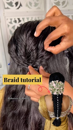 Makeovers by Ramya on Instagram: "Here’s a refined take on the usual messy braid: a loose, textured style incorporating a delicate lace braid for added flair and a touch of pastel flowers enhances the messy braid, adding an elegant finishing touch."