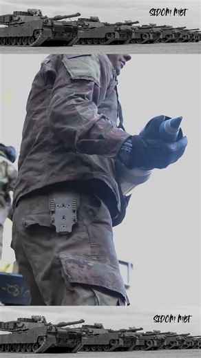 Crew loading an M1A2 Abrams tank