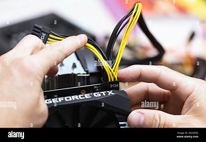 connecting power supply to video card by PCI-E 8 pin cable. Close up of person installing Computer Graphic Card on professional computer. Russia, 17.0 Stock Photo - Alamy