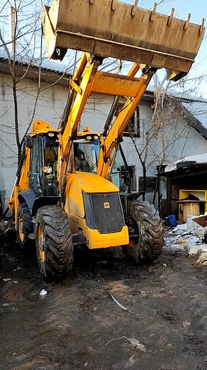 Exploring the Yellow JCB Backhoe Loader in Action
