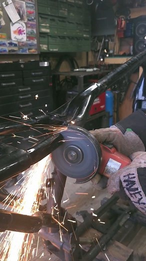 Hayley on Instagram: "Hardtailing the Harley Davidson Sportster frame after machining a few custom spacers on the lathe to dial in the neck alignment. Once everything was square on the jig, I locked it down and welded it in place. Surprisingly, for the amount of prep, this was the most straightforward part of the process. The factory seat post area on these frames is a mess clearly not designed with removal in mind. Next up: cleaning up the rear engine mount and fabricating axle plates to finish