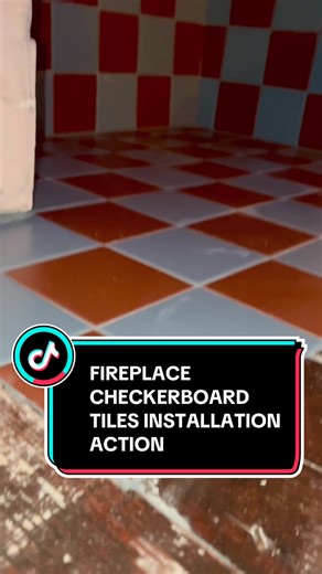 Epic fireplace tiling with checkerboard tiles 🤌 Get your fireplace tiled 🔜 #fireplace #fireplacetile #tileinstallation #tilework #homeimprovement