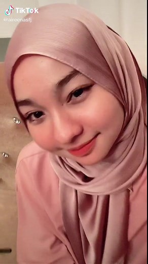 Elegant Indoor Fashion Showcase with Pink Hijab