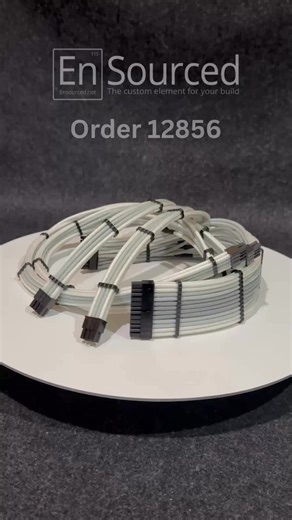 Let's talk about why monochrome builds just work. Order 12856 is a full set of Lian Li Type One modular replacement cables. The customer put together a gradient using Light Gray, Silver, and White. A lot of people go for all-white cables in white cases, but I think this is the better play. By adding the Silver and Light Gray, plus the Black wire wraps and connectors, you get actual depth and contrast instead of everything just blending into the background. It is clean, it is sharp, and it is goi