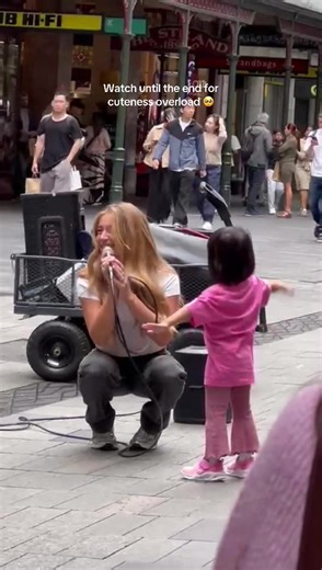 Adorable Busker Captivates Audience