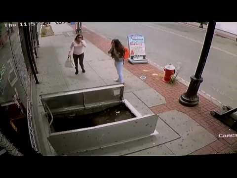 Woman Falls Into Open Sidewalk Hatch While Texting