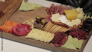 Appetizers boards with assorted cheese, meat, grape and nuts. Charcuterie and cheese platter. Speed Motion