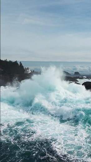 Drone Shot of Amphitrite Lighthouse Ucluelet with a Large Wave Crashing in Front, Vancouver Island