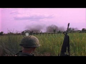 The Douglas A-1E Skyraider, US bomber dives and shells burst on Vietcong position...HD Stock Footage