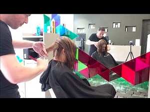 A graduated bob haircut with undercut