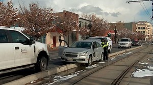 Suspected DUI driver crashes car into TRAX train, UTA bus