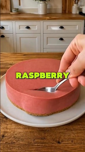 Smooth no-bake raspberry cheesecake with a vibrant color and creamy texture. #Raspberry #Cheesecake