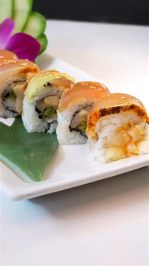 🍣 Introducing the roll you've been dreaming about: The Hana Hou! At Hapa Sushi Grill & Sake Bar🤤 ​Get ready for an explosion of flavor with every bite of this masterpiece. ​Inside, you've got a killer combo of spicy scallop and crispy tempura negi (green onion). But we don't stop there! This beauty is topped with perfectly seared albacore, creamy slices of avocado, and a bright, zesty finish of jalapeño ponzu. 🌶️ ​It's rich, it's spicy, it's fresh, and it's absolutely unforgettable. "Hana Hou