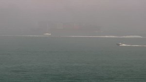 Red Jet ferry arriving in thick fog. You can just see a container ship leaving Southampton behind her...! | Isle of Wight Webcams