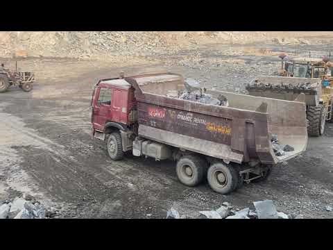 Caterpillar Power: Huge Rocks Loaded with Ease""Extreme Stone Loading | CAT Excavator in Action"