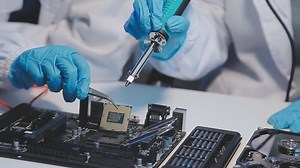 Download Close up portrait of computer engineer's hand is holding CPU's computer. for free