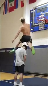 Incredible windmill dunk over a person