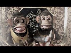 Mechanical cymbal banging monkey