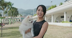 Woman hug with her dog at park