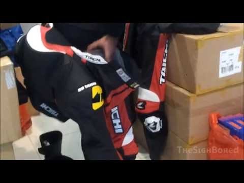 Random: Putting on and removing full leather motorcycle racing suit