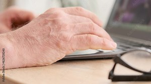 close-up mature male hands typing text on laptop keyboard, senior wellbeing, highlighting increasing digital literacy and empowerment of older adults, Typing Skills, Remote Work