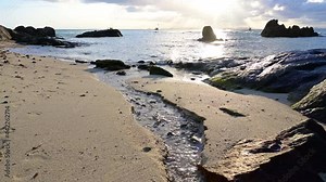 Beautiful view of rocks beach with blue ocean wave motion with 4K resolution.