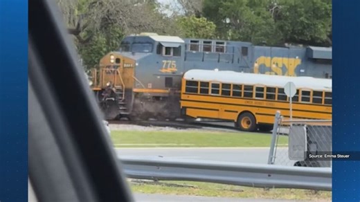 Video shows train nearly crash into school bus in Sumter County