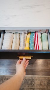 When I stopped folding my dish towels and started rolling them instead, I realized I could store so many more in my kitchen drawers! PLUS, they're easier to see and access. Are you a folder or a roller when it comes to your kitchen linens? #thediymommy #kitchenhacks #homehacks #homeorganization | Cozy DIY Home
