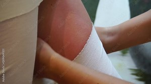 The procedure of cosmetic wrapping a woman's body with a tissue soaked in cosmetic oils.