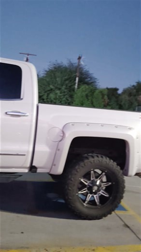 truck parked in a handicap with no markings of a handicap sticker