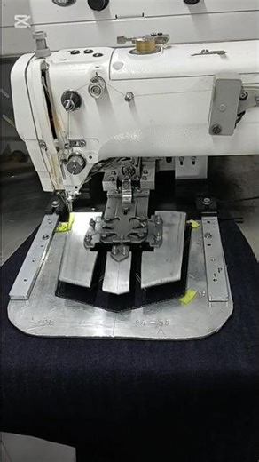 Automatic pocket attaching machine.
