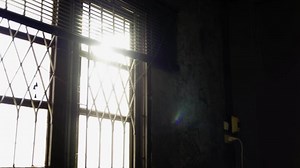 Shade and shadow on old window. Morning sunlight shining through the window. A ray of morning sun in an old window.