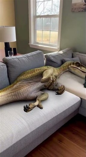 Velociraptor gets comfy on your couch! #ai #funny #short