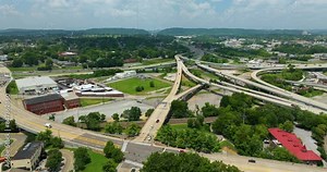 American freeway intersection with fast driving cars and trucks in Knoxville, Tennessee. View from above of USA transportation infrastructure.