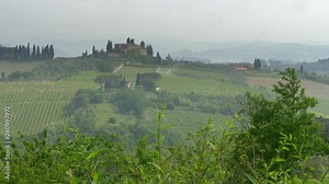 Panorama of classical Tuscany landscape. Hills covered with mist. Tuscany is a region in Italy, where Florence, Pisa, Siena, San Gimignano etc are located. UHD