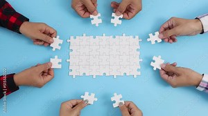 Group of business people assemble jigsaw puzzles, concepts of cooperation, teamwork, help and support in business, symbol of association and connection. business strategy.