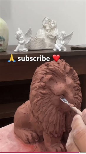 Making sculpture lion statue on clay
