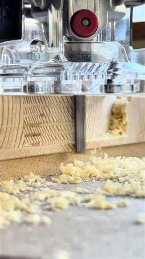 using a wood router with a circular jig to cut a perfect circle and create piles of wood shavings