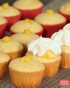 Swirls of vanilla buttercream crowned with store-bought dried orange slices take these orange curd cupcakes over the top. Get the Martha Bakes recipe: https://bit.ly/3zEASYa | Martha Stewart