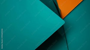 Abstract teal and orange angular shapes are captured in a pan shot under hard lighting.