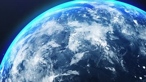 Zoom in Earth in space view with shining sunrise in universe and galaxy background