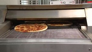 146K views · 3.2K reactions | Robots are taking over the pizza industry. At Pizza HQ in New Jersey, the assembly line to get the sauce, cheese and pepperoni is done by machine. "We use a dough press to help us create uniform 16-inch pies, and then we feed the dough through a piece of robotics equipment that helps us sauce and cheese the pies in a very consistent manner,” owner Matt Bassil told CBS News. | Inside Edition | Facebook