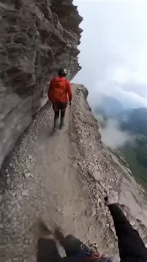 A hiker's worst nightmare caught on camera! This rockslide wiped out the path just feet in front of them. 😱 #CloseCall #Rockslide #Hiking #Mountains #Terrifying #Adrenaline #Adventure | Reality Break