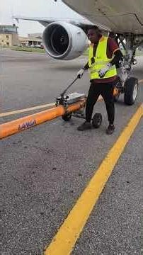 Inside Airport Ramp Life Pushback Man Assisting Jet Departure | GSE Operator Pushing Back Aircraft