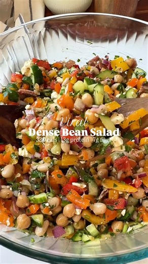 Brittany Mullins | Health Coach | Easy Recipes on Instagram: "I’ve been all about hitting my fiber goals lately and the VIRAL DENSE BEAN SALAD makes it so easy. 🫘🙌 I can’t believe it took me so long to try this recipe inspired by @violetwitchel! My spin is hearty, filling, and packed with fiber (and added protein). I love making a batch for the week because it makes a ton and holds up really well in the fridge. It’s great paired with a protein for quick lunches and dinners, but also works as a