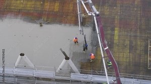 building a floor by pumping liquid concrete for Concreting on a construction site